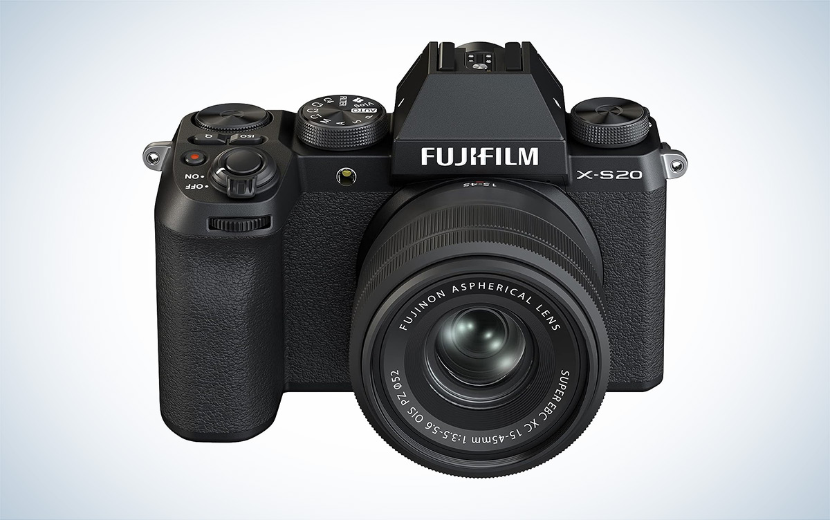 The black Fujifilm X-S20 mirrorless vlogging camera with lens attached against a white backround