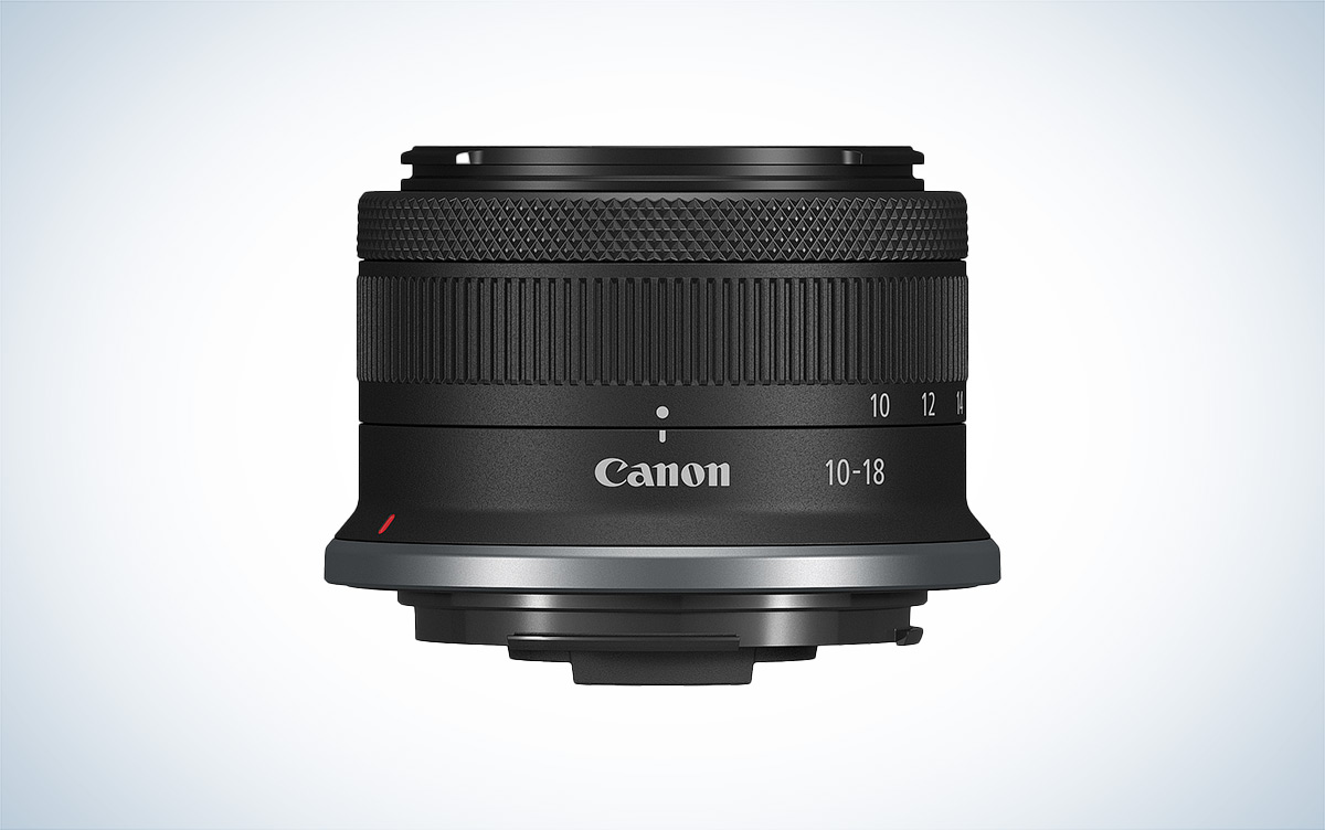The Canon RF-S 10-18mm f/4.5-6.3 compact camera lens is placed against a white background.
