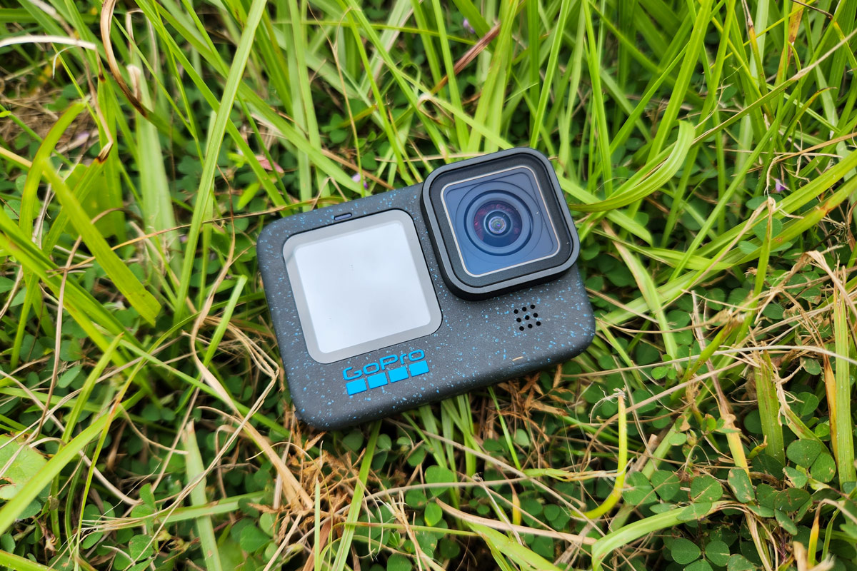 The GoPro Hero12 Black laying in the grass.