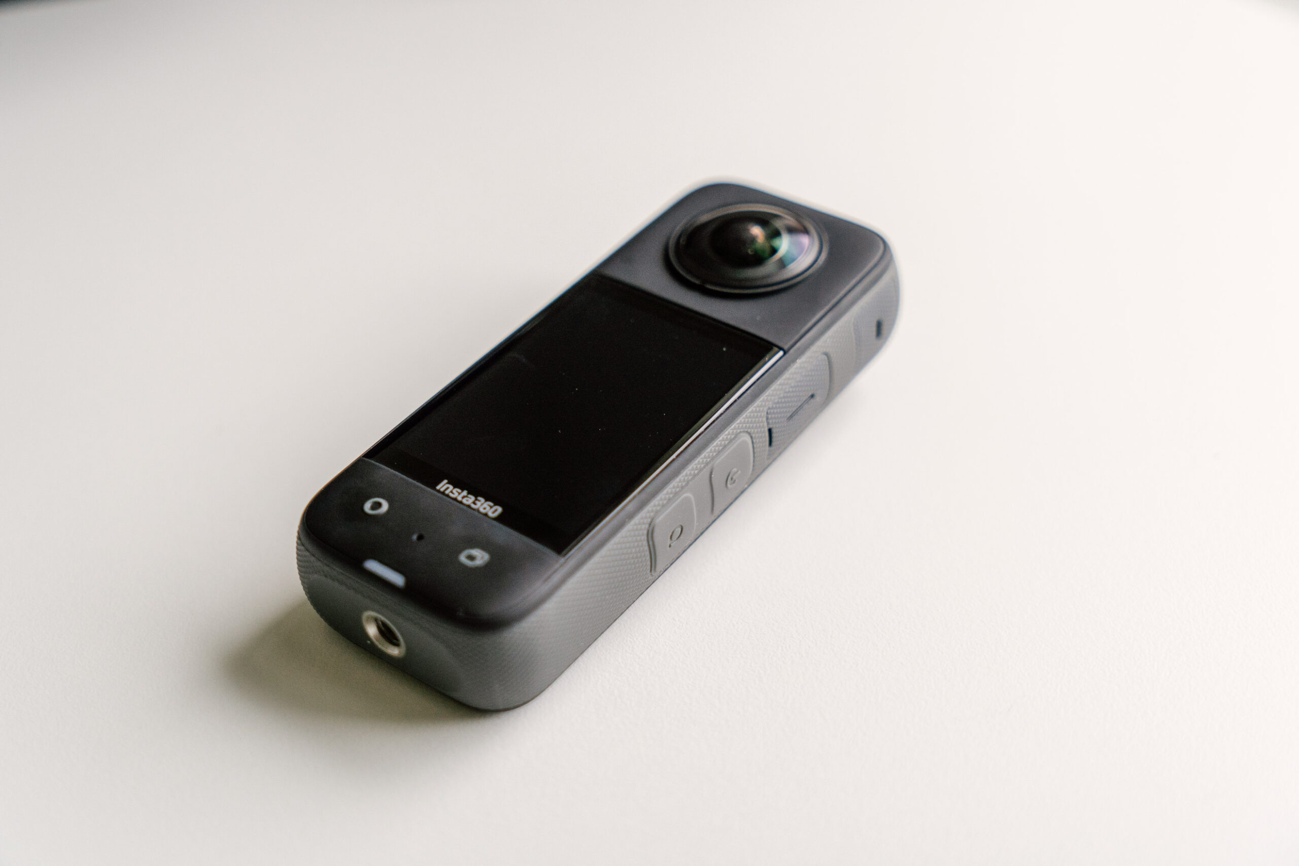 The Insta360 X3 on a white table