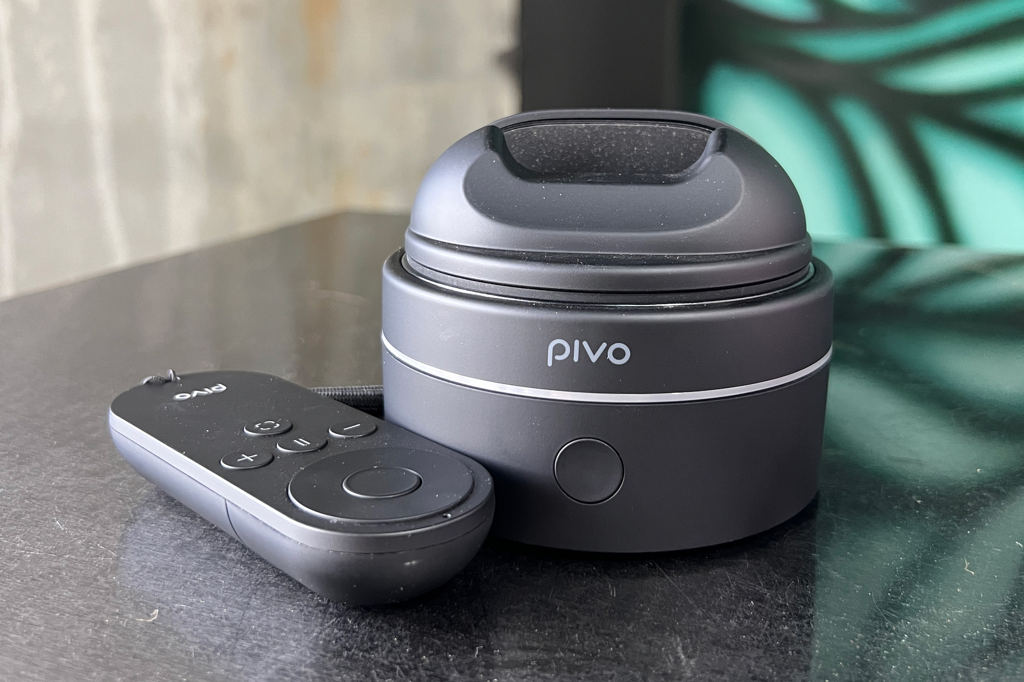 The Pivo Max and remote on a table