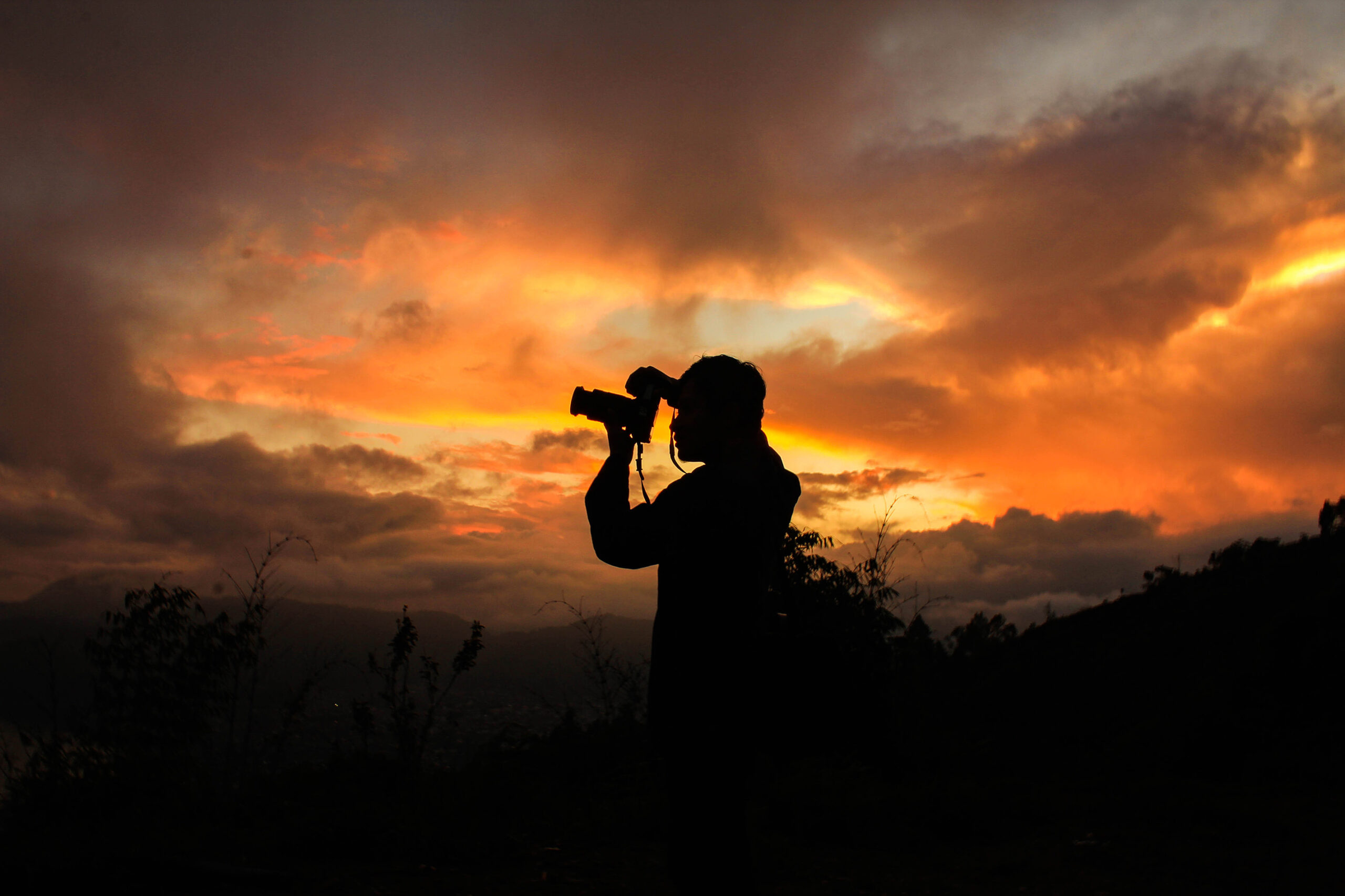 A photojournalist was caught on camera staging a shot, and the backlash was swift