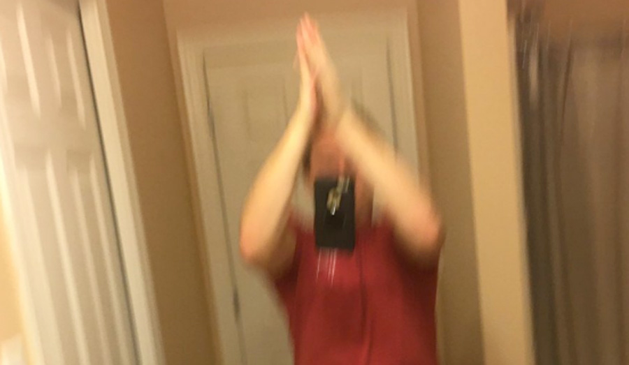 The Current High-Five Selfie Trend Requires You To Throw Your Phone